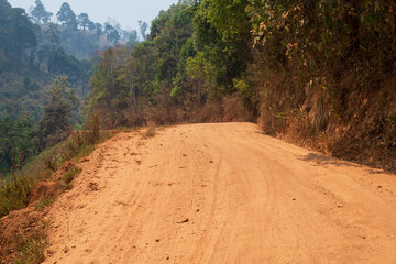 View of dirt road in countryside.