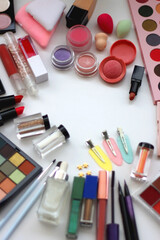 Various colorful beauty products on white background. Selective focus.