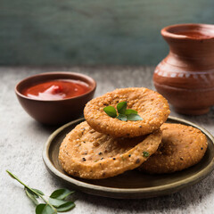 kachori is a flat spicy snack from india also spelled as kachauri and kachodi - obrazy, fototapety, plakaty