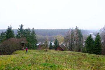 Panorama of open-air museum with traditional houses from Kurpie in Nowogrod with lake in background, ethnic region in Poland