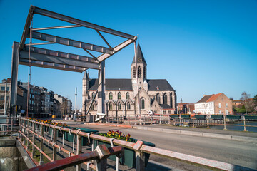 View on the Tolpoortbrug or toll gate bridge located near the church in City Deinze Belgium.