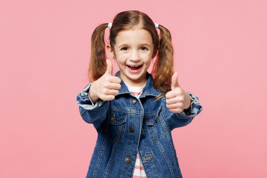 Little child cool smiling cute kid girl 7-8 years old wearing denim shirt have fun showing okay ok gesture isolated on plain pastel light pink background. Mother's Day love family lifestyle concept.