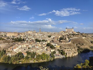 Fototapeta na wymiar Breathtaking view of the city of Toledo, Spain, situated atop a hill overlooking a river.