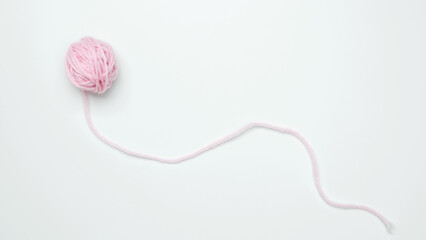 Color yarn for knitting, white background. Top view. Copy space, flat lay