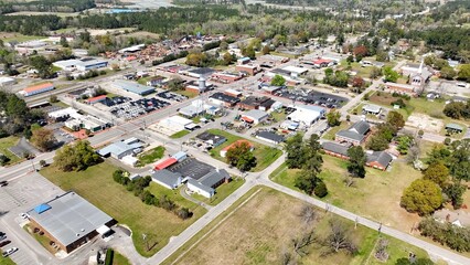 Small town in the South in America with main street, small business and homes with downtown daily life and business in Hemingway, SC in rural countryside on a sunny day