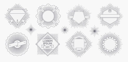 Set of outline heraldic emblems and  labels with sunburst rays. Vector illustration.
