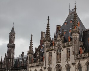 Fototapeta na wymiar Roof of the Provincial Court in Bruges with multiple spires. Belgium.