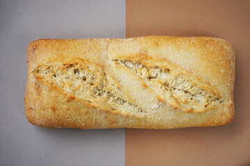 Wheat ciabatta on brown-gray background