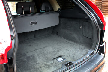 Opened empty car trunk. SUV Car Trunk. Huge, clean and empty car trunk in interior of compact suv.
