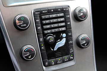 Modern car dashboard. Car climate control. Car multimedia system. Climate control dashboard display. Luxury car air conditioner.