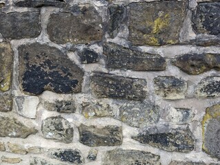 Old stonework wall with lichen