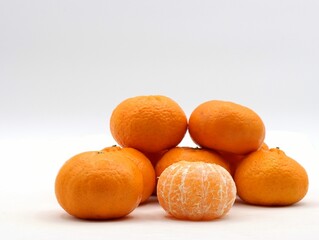 Stack of fresh, juicy mandarin oranges piled upon each other in an attractive display