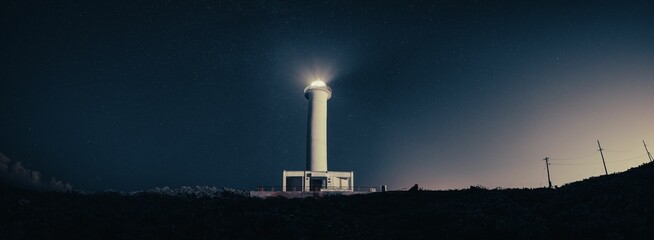 Cape Zanpa Lighthouse in Okinawa, Japan, with a stunning star field in the night sky behind it