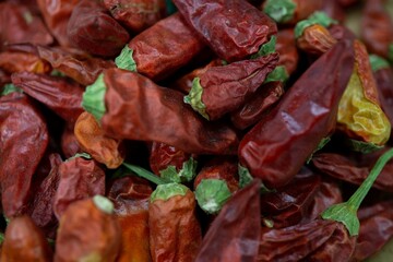 Closeup of a pile of dry red hot chili peppers