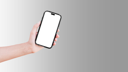 Close-up of hand holding smartphone with blank on screen isolated on background of grey.