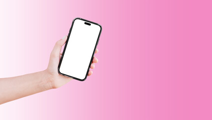 Close-up of hand holding smartphone with blank on screen isolated on background of pastel pink.