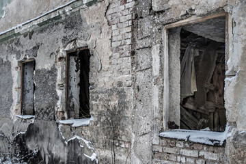 Capture the poignant aftermath of the war with this photo showcasing destroyed old houses in a village. Perfect for illustrating themes of rebuilding, recovery, and the enduring spirit of communities