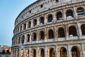 Rome, Italy - September 18 2020: Colosseum ancient gladiator arena and amphitheater, famous tourist landmark and heart of Roman Empire. During a quiet sunny summers day due to the covid 19 pandemic. 
