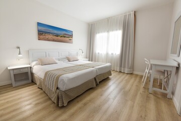 Modern and clean bedroom with single beds and other elegant details