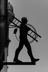 Bronze sculpture of a man: chimney sweeper rauchfangkehrer silhouette in Vienna