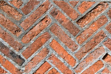 Closeup of an old brick with some cracks in it