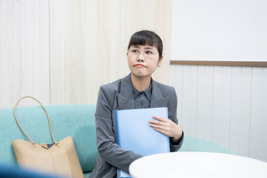 Middle-aged female job seeker waiting for interview