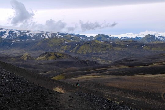 Rugged mountain path, surrounded by picturesque snow-capped peaks: Laugavegur trail, Iceland