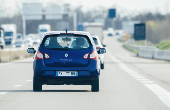 Strasbourg, France - Mar 20, 2024: A Renault Twingo driving on a French highway with traffic in the background, capturing the flow of daily transportation in the region