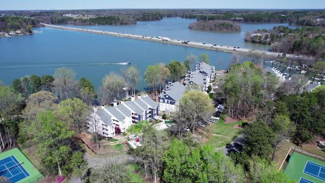 Motor boat heads in to port on Lake Norman in Davidson, NC