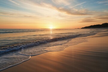 Peaceful beach at sunrise, with gentle waves lapping at the shore