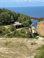 Aerial view of Bornholm, Denmark with a granite quarry, and a metal bridge