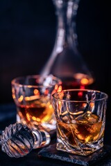 Glass of whiskey on a dark background