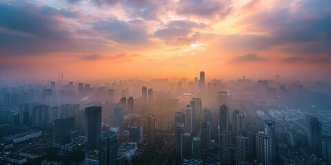 Fototapeta premium A city skyline with a beautiful orange sunset in the background