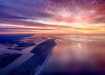 Aerieal view of sunrise over Long Island, New York and the Atlantic Ocean on a fall morning