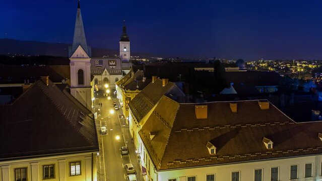 Church of St. Mark day to night transition timelapse and parliament building Zagreb, Croatia. Top view from Kula Lotrscak tower viewpoint after sunset