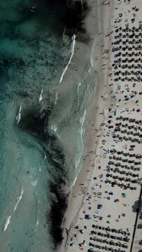 Aerial view 90 degrees. Mallorca beach. Spain. Transparent water. Vertical video for social network.