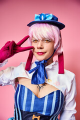 joyful young woman cosplaying anime character and showing peace gesture and looking at camera