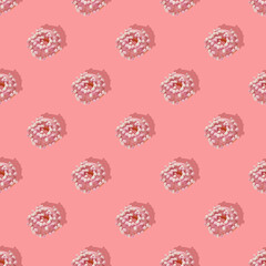 Repeating pattern of pink donuts with marshmallows on a pink background