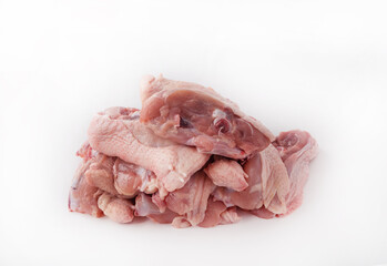 Pile of chopped chicken slices for roast on white isolated background