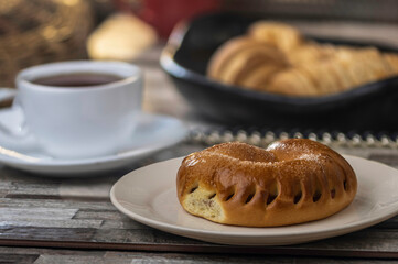 Ajwa Agwa bun stuffed with dates, a delicious glazed dessert along with a sugar donut and sandwich: traditional and tasty sweets.