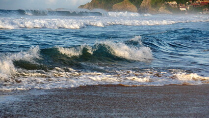 Waves breaking on the beach in Zipolite, Mexico