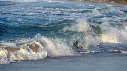 Waves breaking on the beach in Zipolite, Mexico