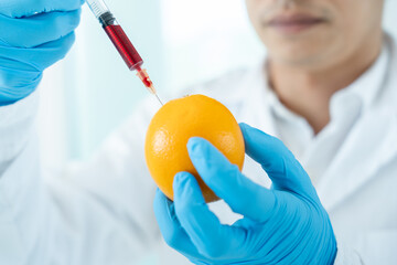 Scientist check chemical food residues in laboratory. Control experts inspect quality of fruit,...