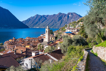Fototapeta na wymiar The town of Ossuccio, on Lake Como, and a section of the Greenway, photographed in summer. 