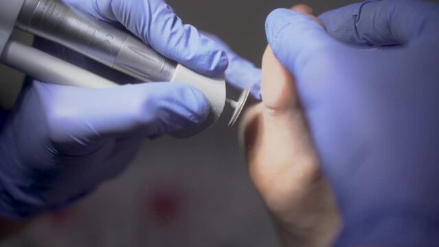 Podiatrist cleans patient's feet in slow motion