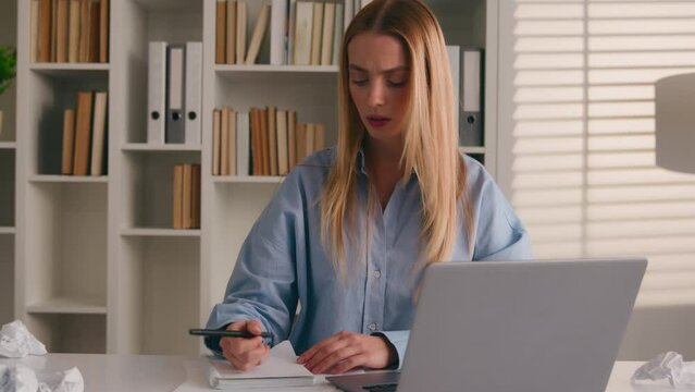 Caucasian businesswoman write business idea paperwork writing stress with mistake lack of inspiration rips sheet of paper from notebook throw away sad unhappy woman writer student girl crumpling notes