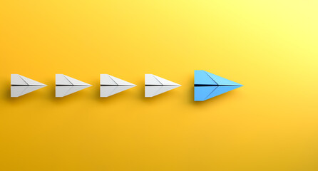 Leadership concept, blue leader plane leading white planes, on yellow background. 3D Rendering