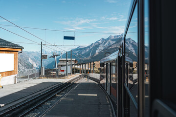 View from train running to station among Swiss Alps at Switzerland - 769849766