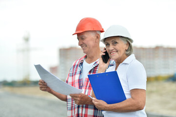Fototapeta premium Portrait of senior couple in under construction