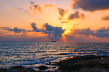 Beautiful sunset sky at beach in Paphos Cyprus showing Demetrios shipwreck and Venus beach 04 June...